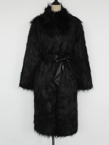 Long black faux fox fur coat with a leather belt shown on a mannequin in a studio