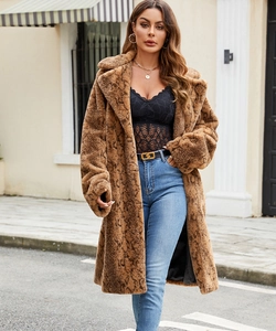 Detail shot of long faux fur coat with dark snake skin pattern and soft plush texture