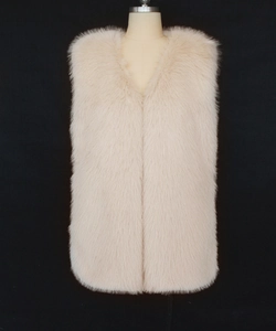 Close-up detail of soft light pink faux fur vest featuring a V-neck and dense plush texture