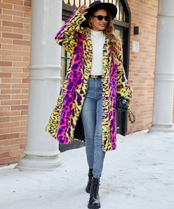 Outdoor street shot of women's long faux fur coat with vibrant neon leopard print pattern