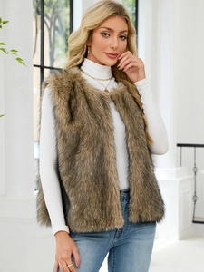 Detail of tan faux fur vest showing plush texture and V-neck styling for women