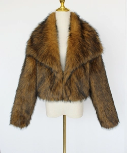 Detail of short faux fur jacket with large lapel in brown showing realistic texture