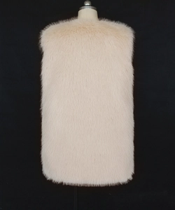 Macro detail of the plush cream faux fur texture on the back of this sleeveless vest