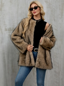 Detailed close-up showing the soft faux fur texture and brown animal print of the coat