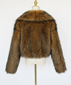 Rear view of tan faux fur short jacket with fluffy texture and round neck design