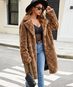 Close-up of brown snake print faux fur coat featuring thick plush texture and lapel