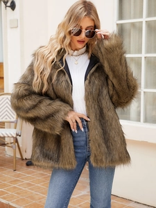 Detailed view of the brown faux fur jacket with fluffy texture and stylish mid-length cut