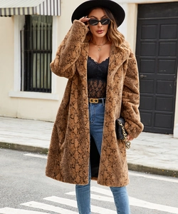 Detailed texture of thick faux fur coat with brown snake pattern and oversized lapel