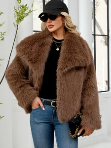 Detail of soft brown faux fur texture and wide lapel collar on a stylish winter coat