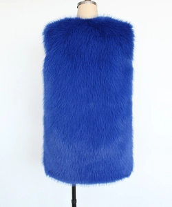 Detailed view of plush faux fur texture on a vibrant royal blue sleeveless vest
