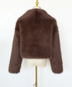 Detail of soft brown faux fur texture on a short-style winter jacket for women