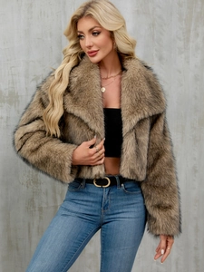 Detail view of the fluffy brown faux fur jacket with wide lapels and soft texture