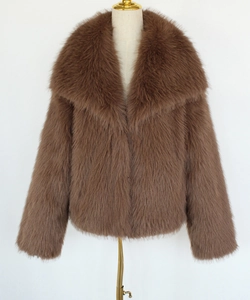 Detail view of the plush brown faux fur texture and large lapel of this winter jacket