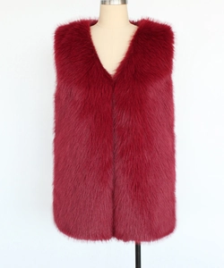 Detail of burgundy faux fur vest featuring deep V-neck and dense plush texture
