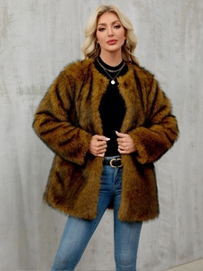 Detail of fluffy brown faux fur coat showing soft texture and premium faux fur material