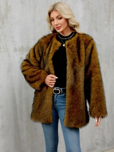 Detail of the soft texture and fluffy long-hair faux fur fabric on a brown coat