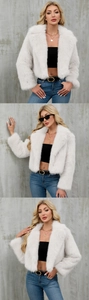 Detailed view of the soft white faux fur texture and short cut design of the jacket