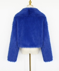 Detail of Klein blue faux fur short jacket showing plush long-hair texture and collar