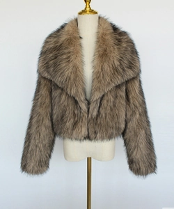 Detailed close-up of brown faux fur bolero jacket with fluffy texture and oversized lapel