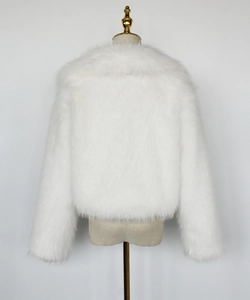 Detail view showing the plush texture and back cut of a white faux fur short jacket
