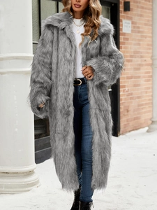 Long grey faux fur coat with oversized lapels and fluffy texture for winter street style