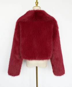Back view of wine red faux fur coat showing dense long plush texture and short silhouette