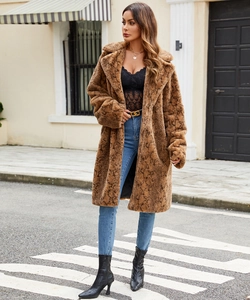 Street style view of a long brown snakeskin faux fur coat with oversized lapels and soft plush