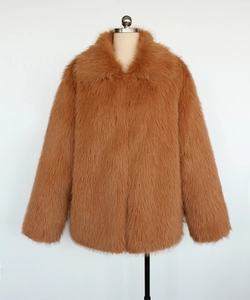 Detail shot of men's brown faux fur jacket featuring large lapel and thick plush texture