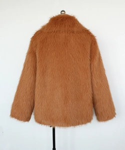 Detailed close-up of ginger brown faux fur texture and wide lapel on men winter jacket