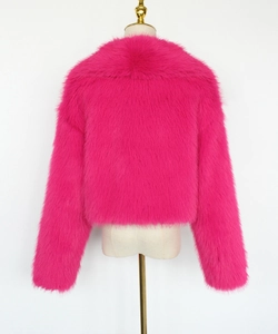 Detail of premium hot pink faux fur texture on short jacket with fluffy long fibers