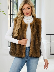 Brown faux fur vest for women styled with a white turtleneck and denim jeans