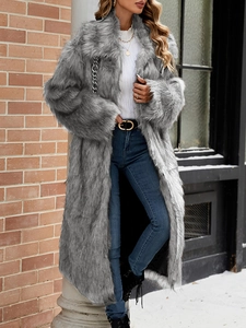 Close-up of thick grey faux fur long coat texture and winter street style detail
