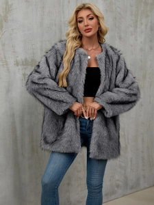Close-up of grey faux fur coat with long sleeves and premium plush texture