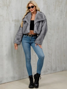 Faux fur jacket detail showing large lapel collar and grey plush texture for autumn fashion