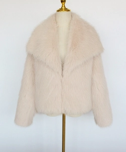Close-up of soft light pink faux fur jacket texture with wide lapels on a mannequin