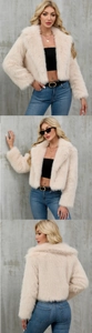 Detail shots of faux fur short jacket in beige with wide lapel and fluffy texture