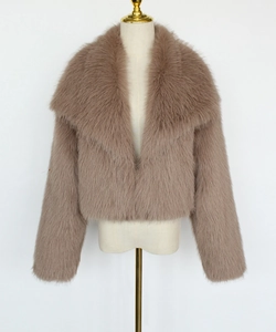 Close-up detail of plush faux fur collar and texture on the dusty pink short jacket