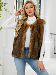 Close-up of brown faux fur vest texture with long hair material and sleeveless design