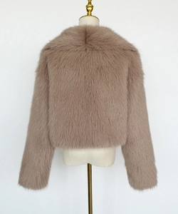 Detail view of the plush mauve faux fur texture and short cut back on women's winter coat
