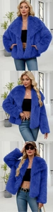 Close-up detail of the plush faux fur texture and large lapel of the royal blue coat