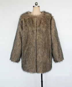 Detailed texture of brown faux fur coat with soft long fibers and gradient tones