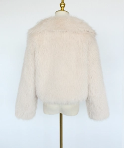 Detail view of the plush cream faux fur back and oversized collar on this short jacket