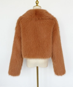 Detailed back view of a brown faux fur short jacket on a white mannequin stand