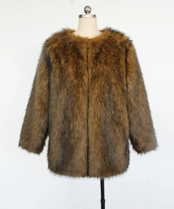 Detail of faux fur coat with brown and black animal texture and thick plush material