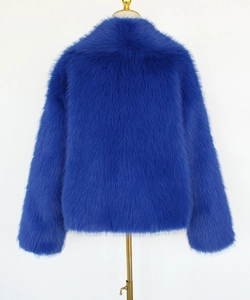Close-up of the plush texture and back of the cobalt blue faux fur short jacket