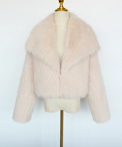 Detailed view of plush light pink faux fur jacket texture and elegant wide lapel design