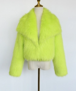 Close-up of fluorescent green faux fur texture and lapel design on short jacket