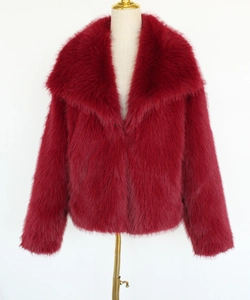 Detailed close-up of faux fur texture on a dark red plush short winter jacket for women