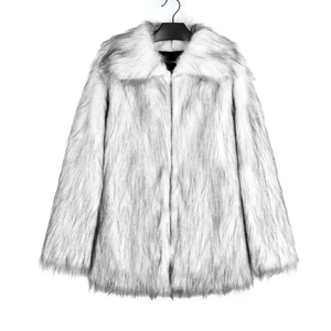 Detail of faux fur coat with large collar showing white and grey texture on a hanger
