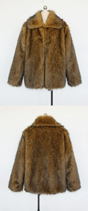 Detail view of gold-brown faux fur jacket showing thick plush texture and large lapel collar